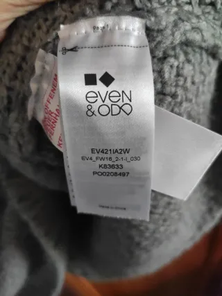 Jersey de tejidos acrilico y cuello alto gris