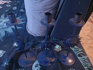 Portacandela a forma di stella con viso