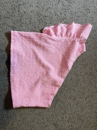 Top rosa con volantes