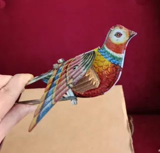 Uccellino di latta con soffietto