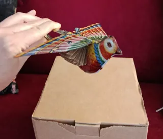 Uccellino di latta con soffietto