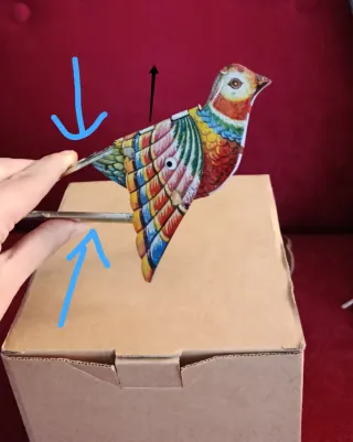 Uccellino di latta con soffietto