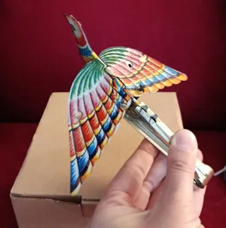 Uccellino di latta con soffietto