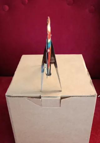 Uccellino di latta con soffietto