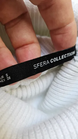 Jersey cuello alto color marfil ochos