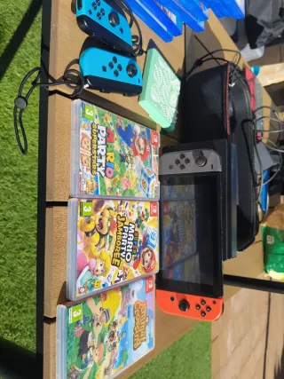 Nintendo Switch con 4 mandos y 3 juegos