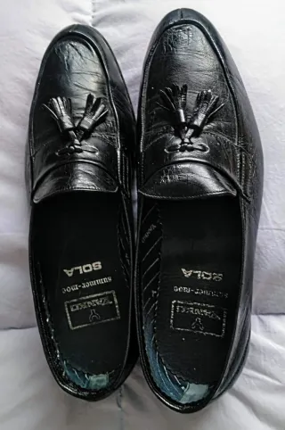 Mocasines negros de piel con flecos