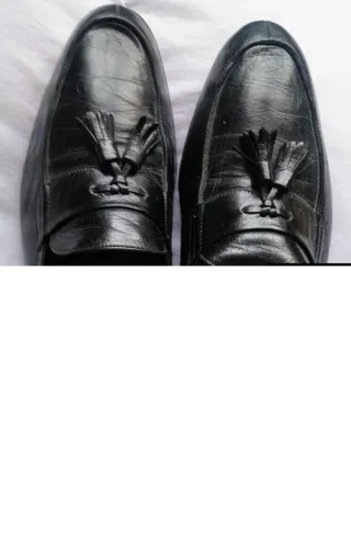 Mocasines negros de piel con flecos