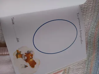 Saco bebé primera postura y Libro del bebé