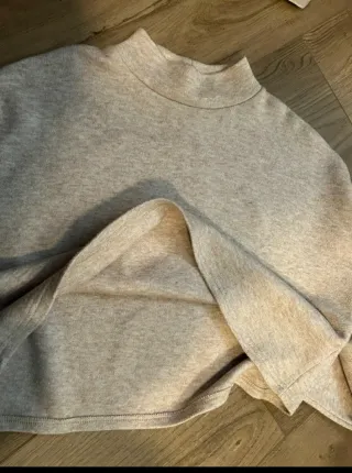 Jersey beige cuello alto mujer