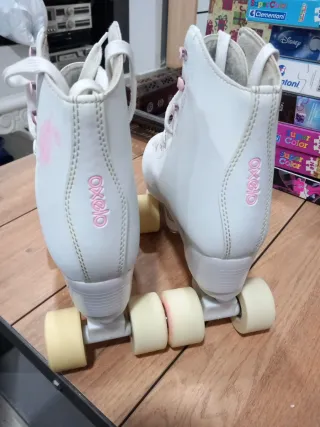 Patines Oxelo blancos y rosas
