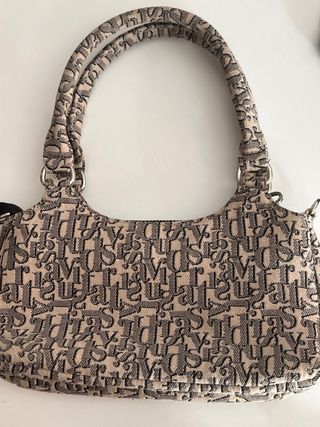 Bolso de mujer beige y negro con logo