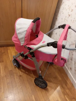 Carrito de muñecas rosa