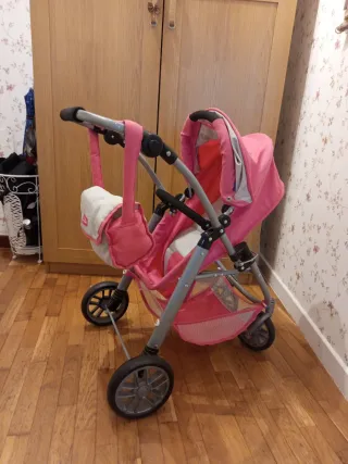 Carrito de muñecas rosa
