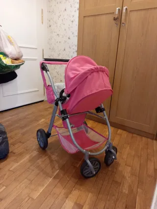 Carrito de muñecas rosa