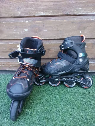 Patines en línea infantiles negros naranjas ABEC 3