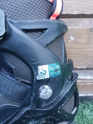 Patines en línea infantiles negros naranjas ABEC 3