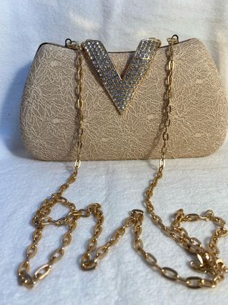 Bolso de fiesta dorado con pedrería