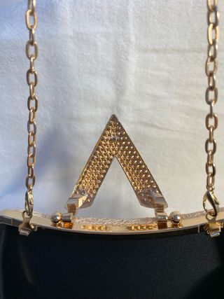 Bolso de fiesta dorado con pedrería