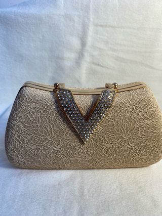 Bolso de fiesta dorado con pedrería
