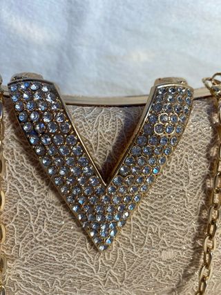 Bolso de fiesta dorado con pedrería