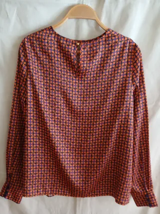 Blusa elegante naranja y morada