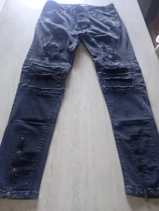 Jeans strappati uomo