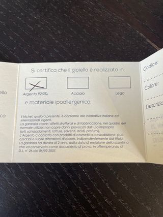 Orecchini a pendente in argento dorato con zircone