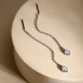 Orecchini a pendente in argento dorato con zircone