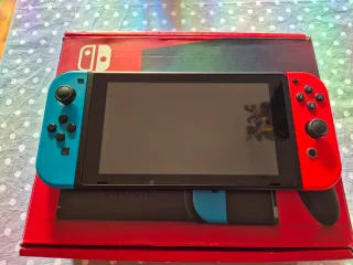 Nintendo Switch Azul/Rojo(UK) + Accesorios