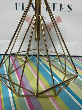 Portavelas de metal dorado y cristal