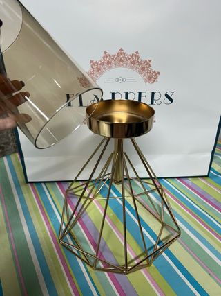 Portavelas de metal dorado y cristal