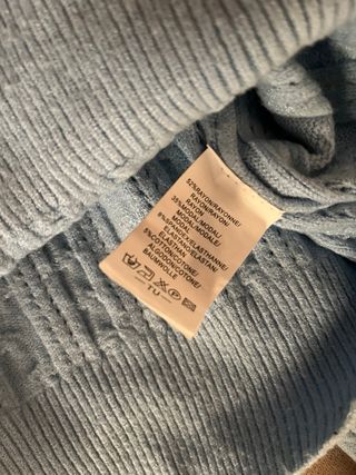 Maglione azzurro con trecce