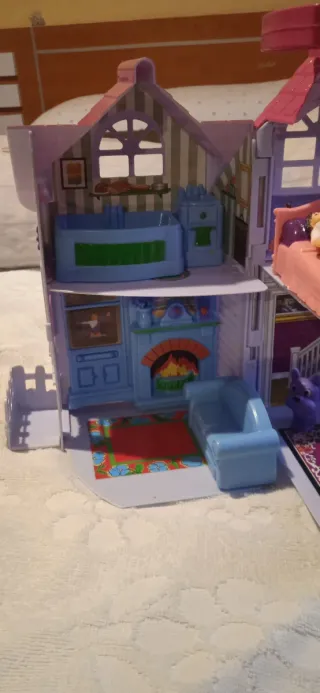 Casita de juguete rosa y morada