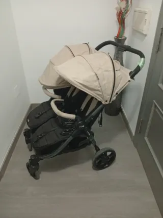 Carro gemelar Niu con funda para lluvia