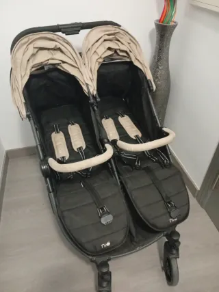 Carro gemelar Niu con funda para lluvia