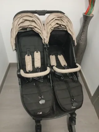 Carro gemelar Niu con funda para lluvia