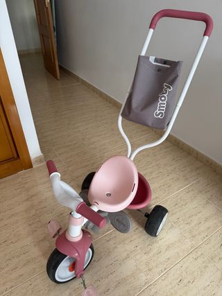 Triciclo Smoby rosa con manillar