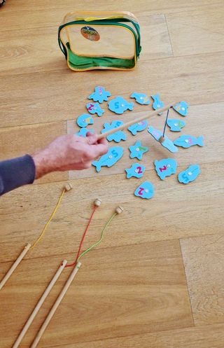 Gioco di pesca con canna e pesci