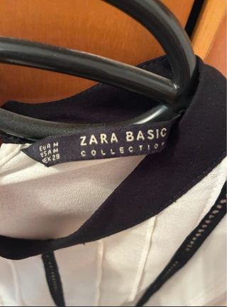Blusa blanca con detalles negros