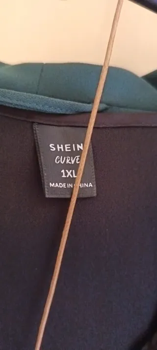 Blazer verde y lencera negra