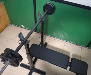 Banco de pesas Corength con barra y discos