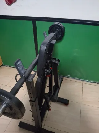 Banco de pesas Corength con barra y discos