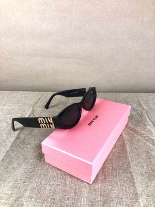 Gafas Miu Miu Negras y Doradas