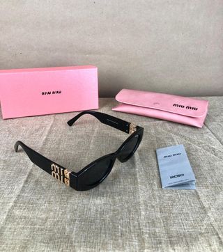 Gafas Miu Miu Negras y Doradas
