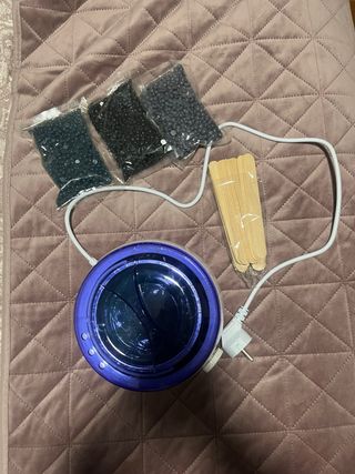 Máquina de cera azul y negra