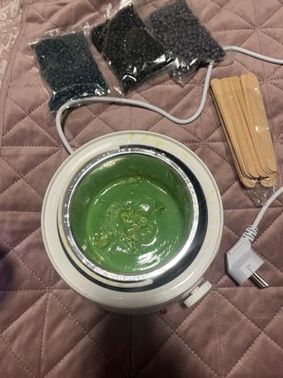 Máquina de cera azul y negra