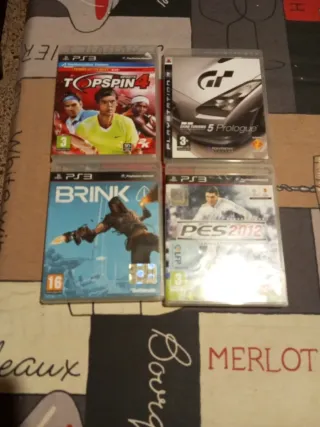 Lote di 4 giochi PS3: Top Spin 4, Gran Turismo 5, Brink, PES 2012