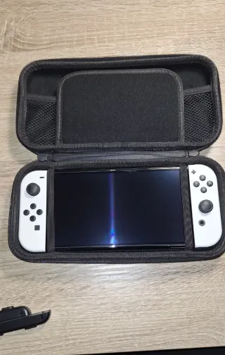 Nintendo Switch OLED Blanca + Fundas de transporte