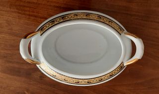 Centrotavola in porcellana con decori oro